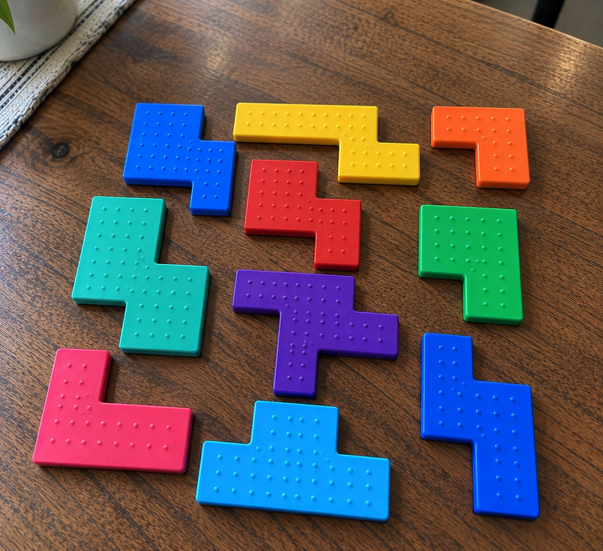TapPuzzle colored pieces laid out on a table